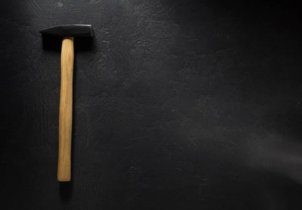 Hammer tool on black — Stock Photo, Image