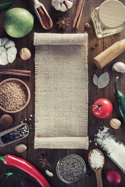 Herbs and spices on wood background — Stock Photo, Image