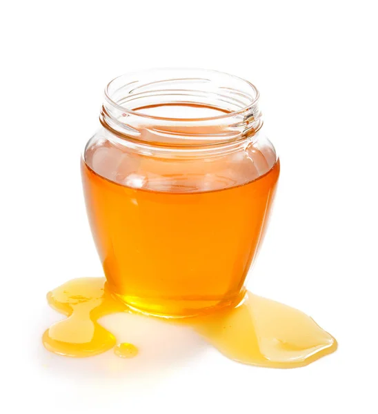 Glass jar of honey and drop — Stock Photo, Image