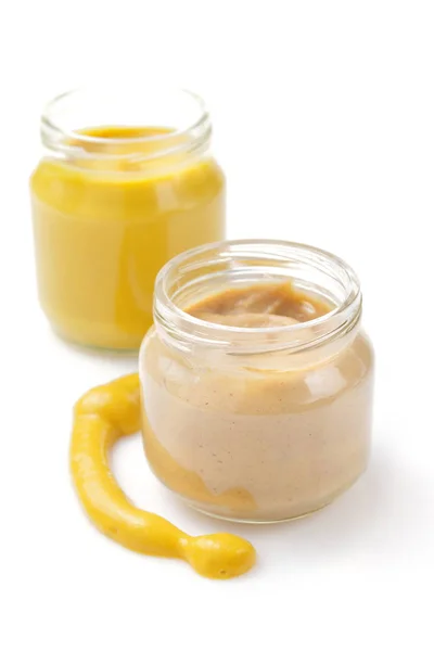 Mustard sauce in jar on white — Stock Photo, Image