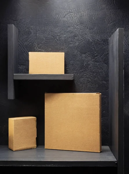 Cardboard box on black background — Stock Photo, Image