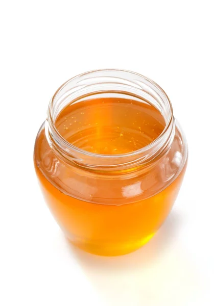 Glass jar of honey — Stock Photo, Image