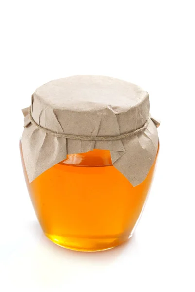 Glass jar of honey — Stock Photo, Image