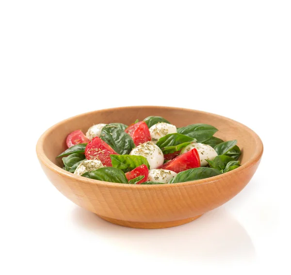 Caprese salade dans une assiette sur fond blanc — Photo