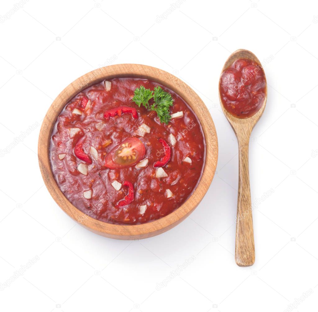 tomato sauce in gravy boat on white 