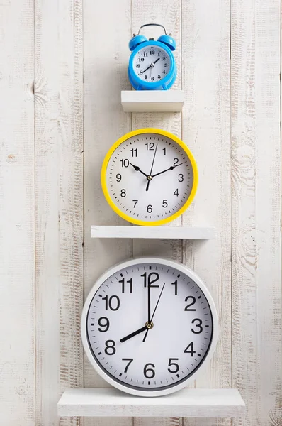 Wall clock at wooden background — Stock Photo, Image