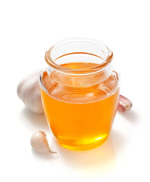 Vaso di miele su sfondo bianco — Foto Stock