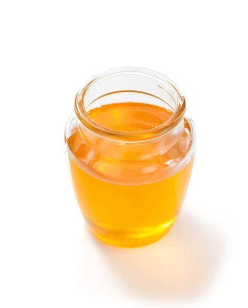 Jar of honey on white background — Stock Photo, Image