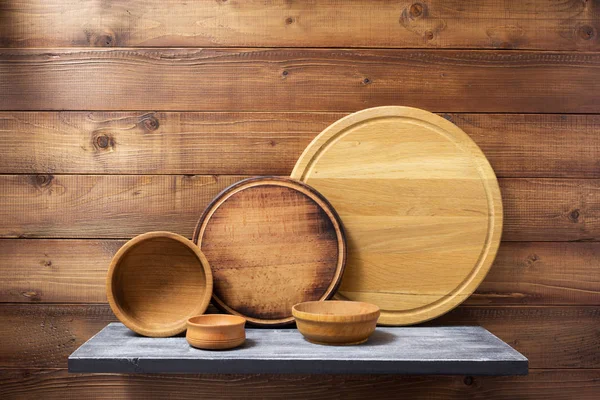 Wooden kitchenware at shelf — Stock Photo, Image