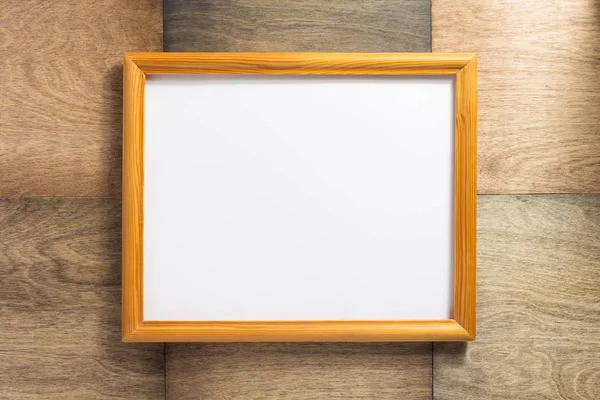Photo frame at wooden background — Stock Photo, Image