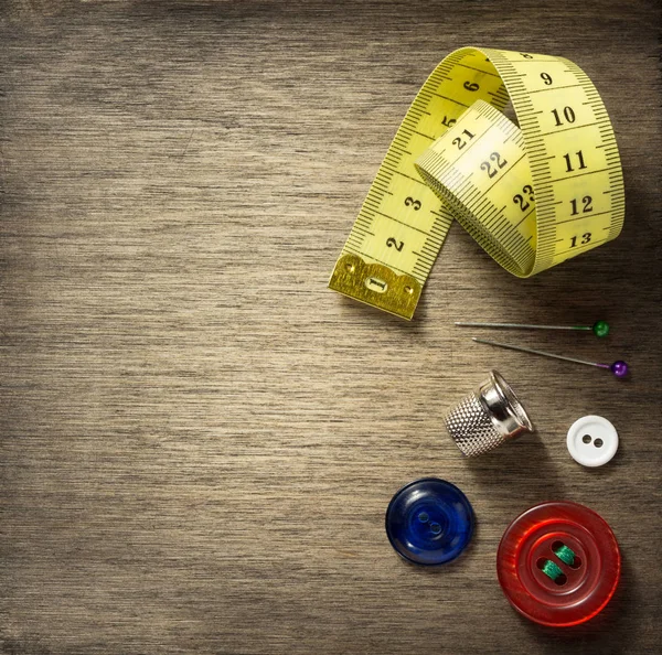 Sewing tools on wooden background — Stock Photo, Image