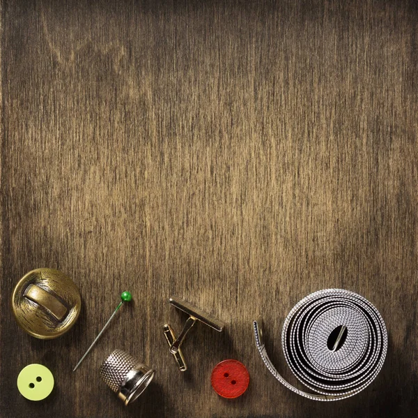 Sewing tools on wooden background — Stock Photo, Image