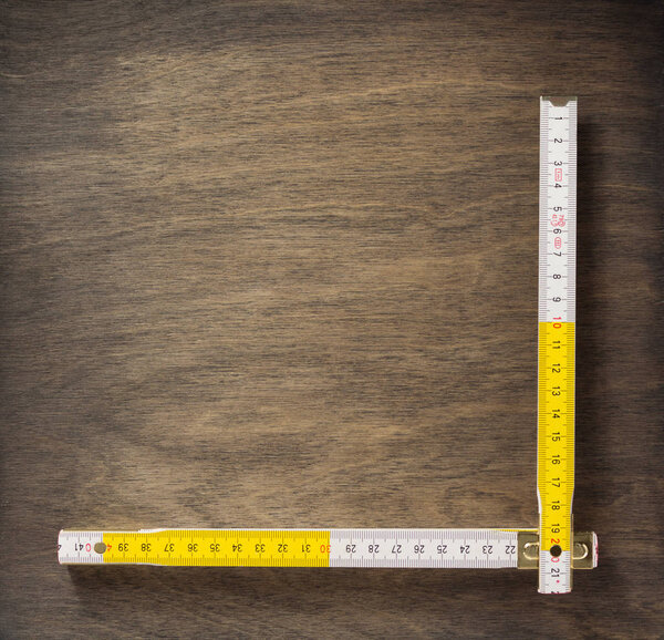 meter ruler on wood