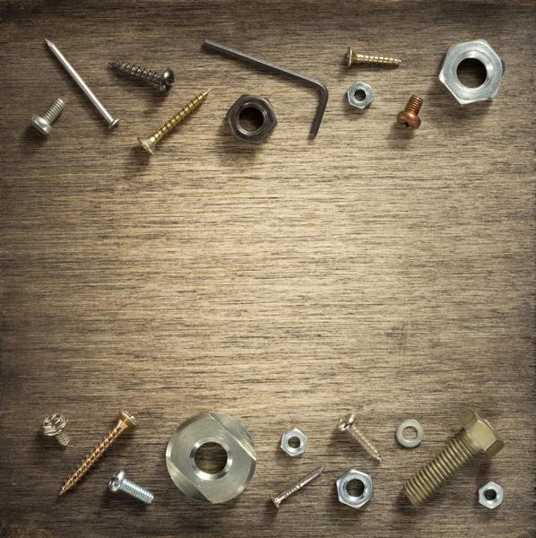 Hardware tools and screws at wood — Stock Photo, Image