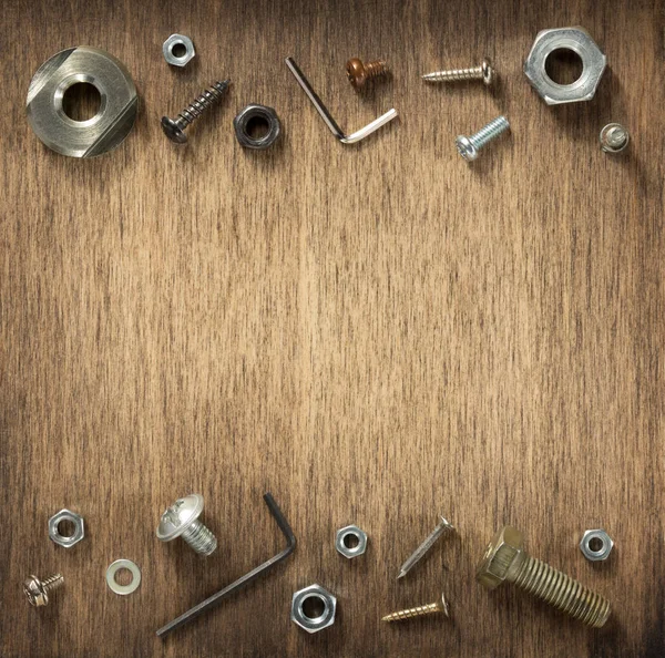 hardware tools and screws at wood