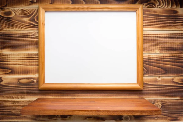 Фото рамка на деревянном фоне — стоковое фото