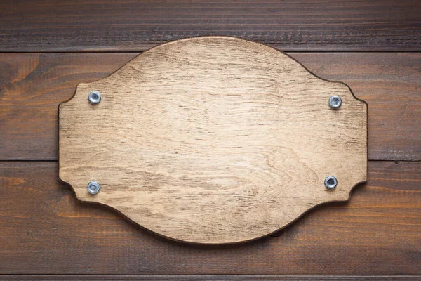Placa de identificación en textura de fondo de madera — Foto de Stock