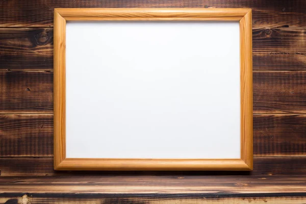 Photo picture frame on wooden background — Stock Photo, Image