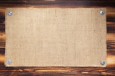 Ahşap arkaplanda çuval bezi dokusu