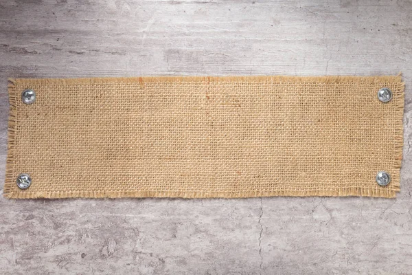 Burlap Hessian pytloviny textura na povrchu kamenné stěny — Stock fotografie