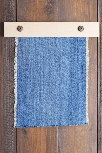Blue jeans texture on wood — Stock Photo, Image