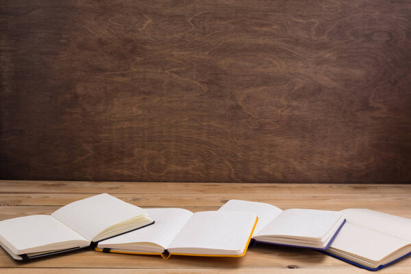 notepad or paper notebook at wooden table background surface table