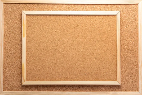 cork board in wooden frame as background texture