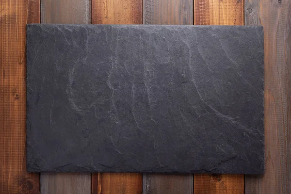 Piedra Pizarra Negra Superficie Textura Fondo Madera —  Fotos de Stock