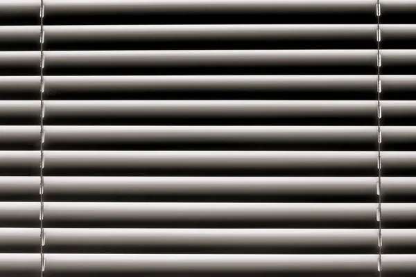 White horizontal blinds on the window create a rhythm_ — Stockfoto