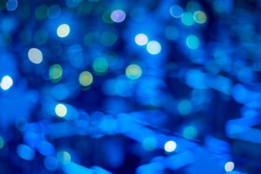 bright white fuzzy lights glow and shine on a dark background_