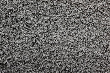 structure of the wall with coarse gray cement plaster_