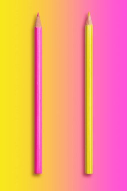 two pencils yellow and pink, gradient background from yellow to  clipart