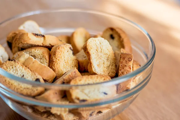 Rusks with raisins in a transparent plate; sweets for tea_ — ストック写真