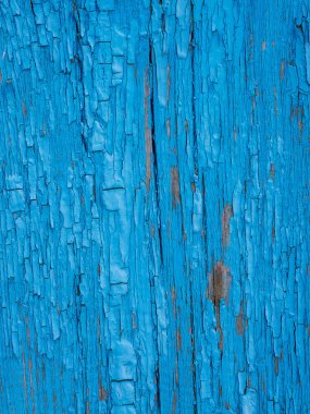 Old board with shabby blue paint - background or texture_