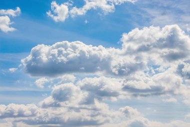 White clouds on  background of  blue sky on  clear, bright day_