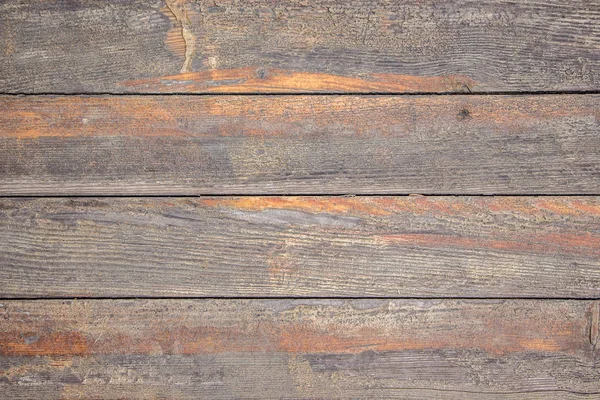 Textura de viejas tablas de madera con rastros de pintura naranja limpiada —  Fotos de Stock