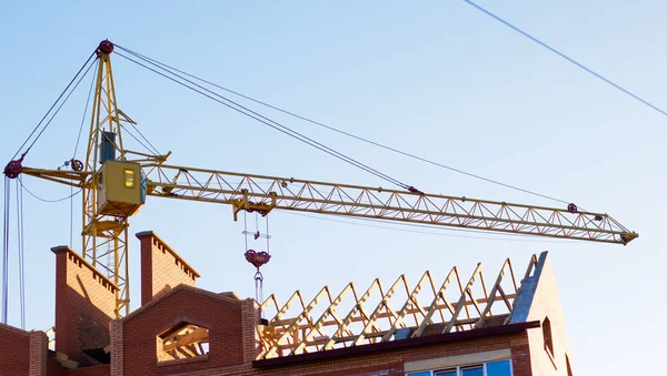 Lifting crane on  background of  building under construction. Ne