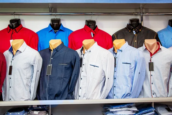 Men's shirts on the mannequins in  store. Men's clothing sale_