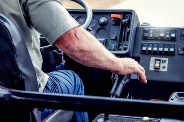 Bus driver switches  speed. Professional vehicle management_