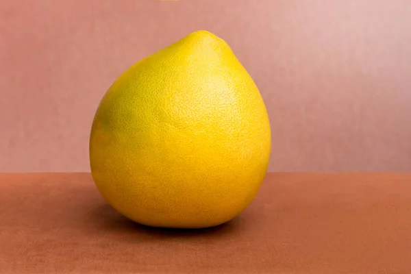 Ripe large fruit pomelo on a brown background_ — 스톡 사진