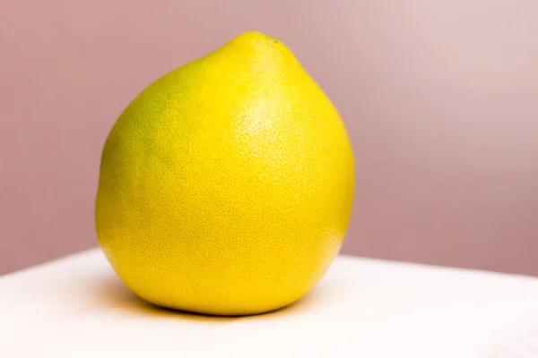 Ripe large fruit pomelo on a light background_ — Zdjęcie stockowe