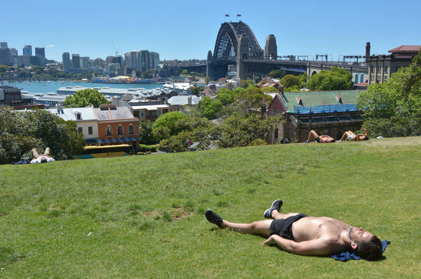 Young Australian man sunbathing in Sydney New South Wales Austra