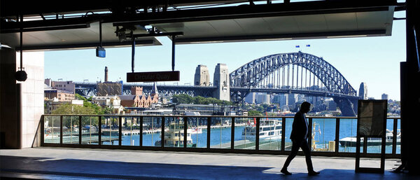 Silhouette of a man against Sydney Harbour Bridge in Sydney Aust