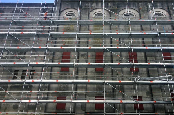 Construction worker assemble scaffolding. With an estimated 2.3 million construction workers using scaffolding, many workers are injured every year and even lose their lives.