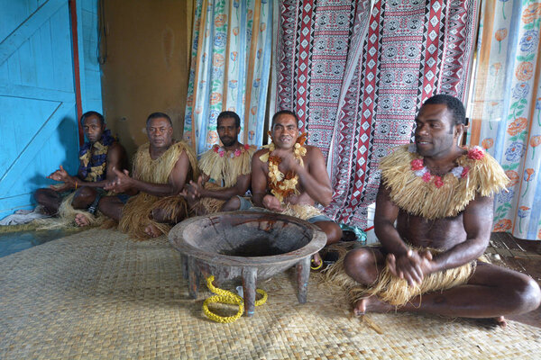 Indigenous Fijians men participate in traditional Kava Ceremony 