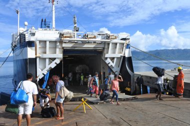 Passengers departing of inter island ferry in Fiji clipart