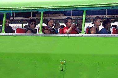 Indigenous Fijian people travel by bus in Fiji clipart