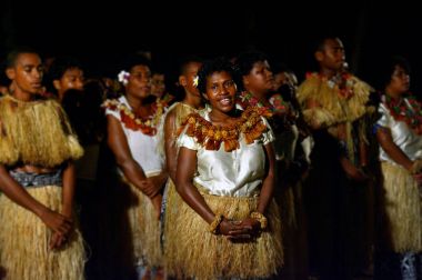 Indigenous Fijian people sing and dance in Fiji clipart