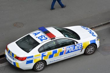 New Zealand Police car and officer on crime respond  clipart