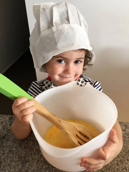 Little girl cooking in kitchen — Stock Photo, Image